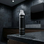 Sharp skincare product on a dark countertop in a bathroom setting